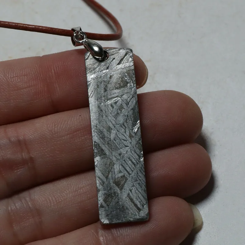 

Muonionalusta Meteorite Necklace Pendant Partially Sliced