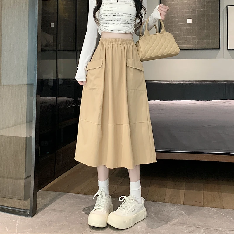 

2024 Minimalist Temperament New Summer High Waisted Slim Fit Elastic Waist Pocket Casual Versatile Mid Length Loose Half Skirt