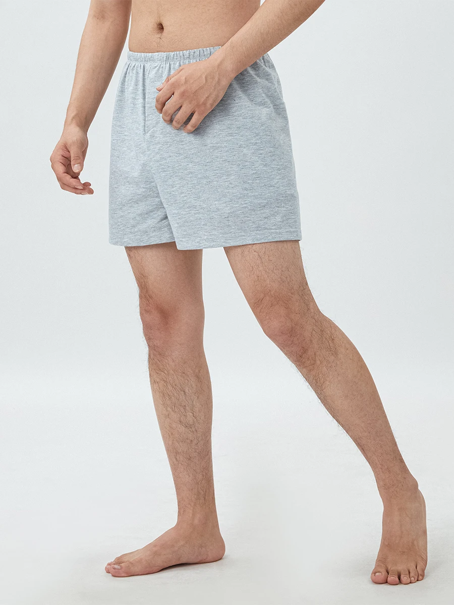 Short de salon pour femmes et hommes, couleur unie, fente latérale, confortable, taille élastique, short de sommeil, pantalon carillon