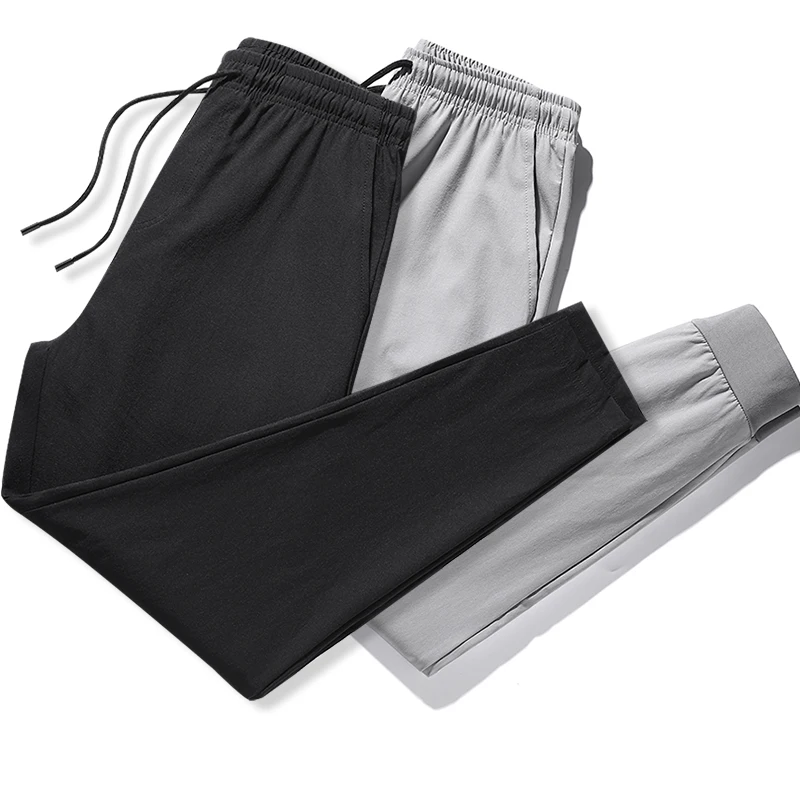 Wysokiej jakości nowa marka casualowe modne elastyczne spodnie dresowe z paskami, długie, ołówkowe, młodzieżowe, dopasowane, szybkoschnące spodnie męskie.