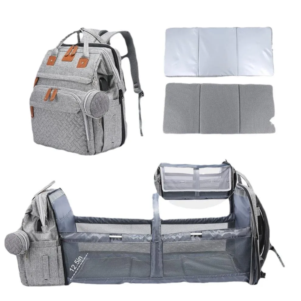 أكياس الحفاضات حقيبة الأم الأعلى الأكثر مبيعًا مع سرير هزاز للأطفال وتصميم مقصورة حقيبة الأم نزهة الطفل