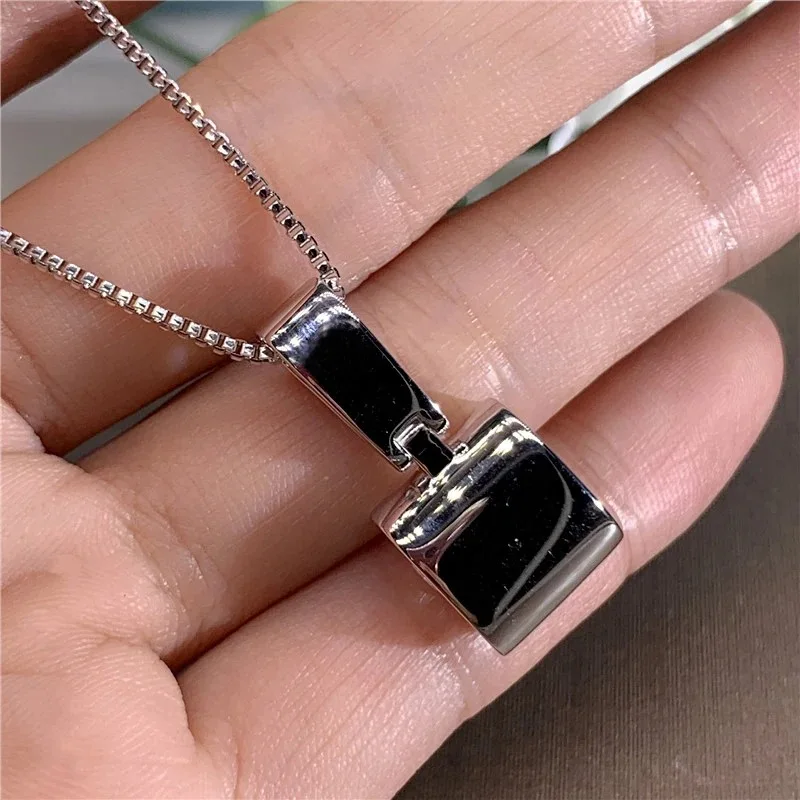 Elegant geometric zircon pendant necklace crafted in copper with brass plating finish featuring round gemstone accent on slub ch