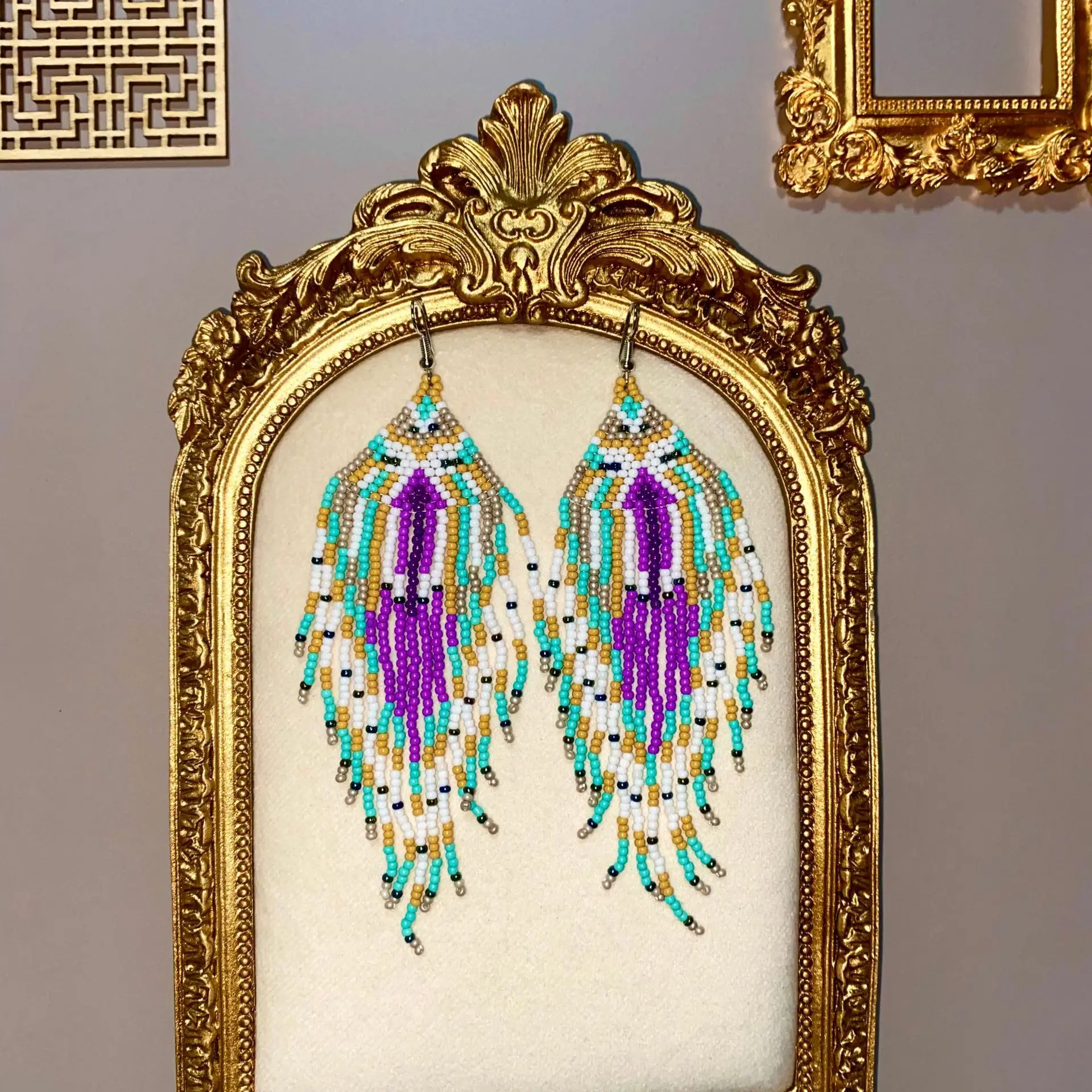 

Bohemia Rice bead earrings Geometry Color mixing Long tassel Hand-woven Alloy Retro Personality Temperament Niche design sense