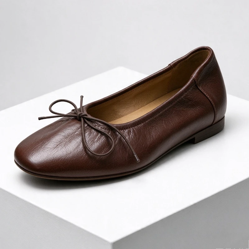 Women's brown soft leather ballet flats with bow detail