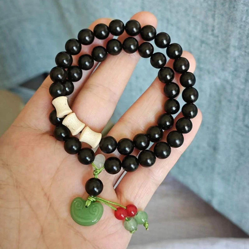 Ebony 8mm double-loop bracelet with Ruyi pendant, gold-threaded bamboo knot accessories, prayer beads, and collectible items