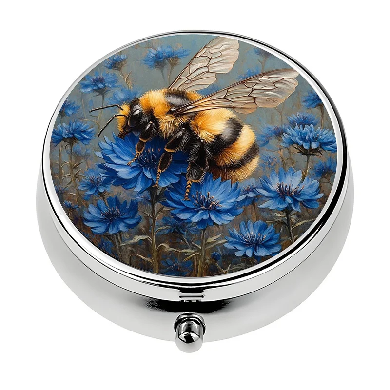 A single portable pill box, designed specifically for travel, featuring three compartments and decorated with bee and flower patterns. This mini container can be used as a pill storage box and decorative metal box, suitable for vitamins.