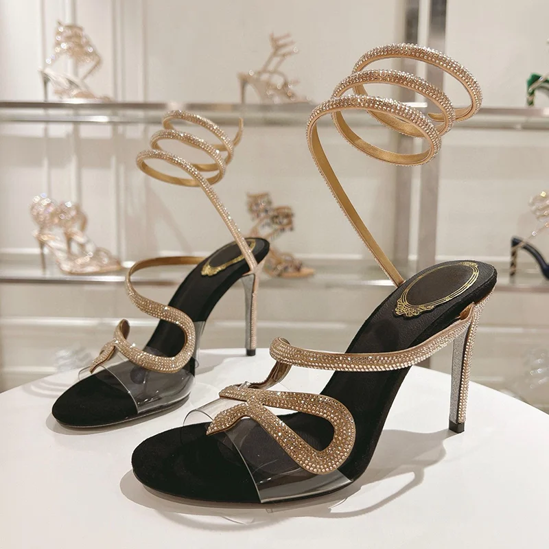 صنادل نسائية صيفية مزخرفة بالكريستال على شكل ثعبان بحزام مطاطي من Sandalias PVC شفافة بحزام واحد وكعب رفيع