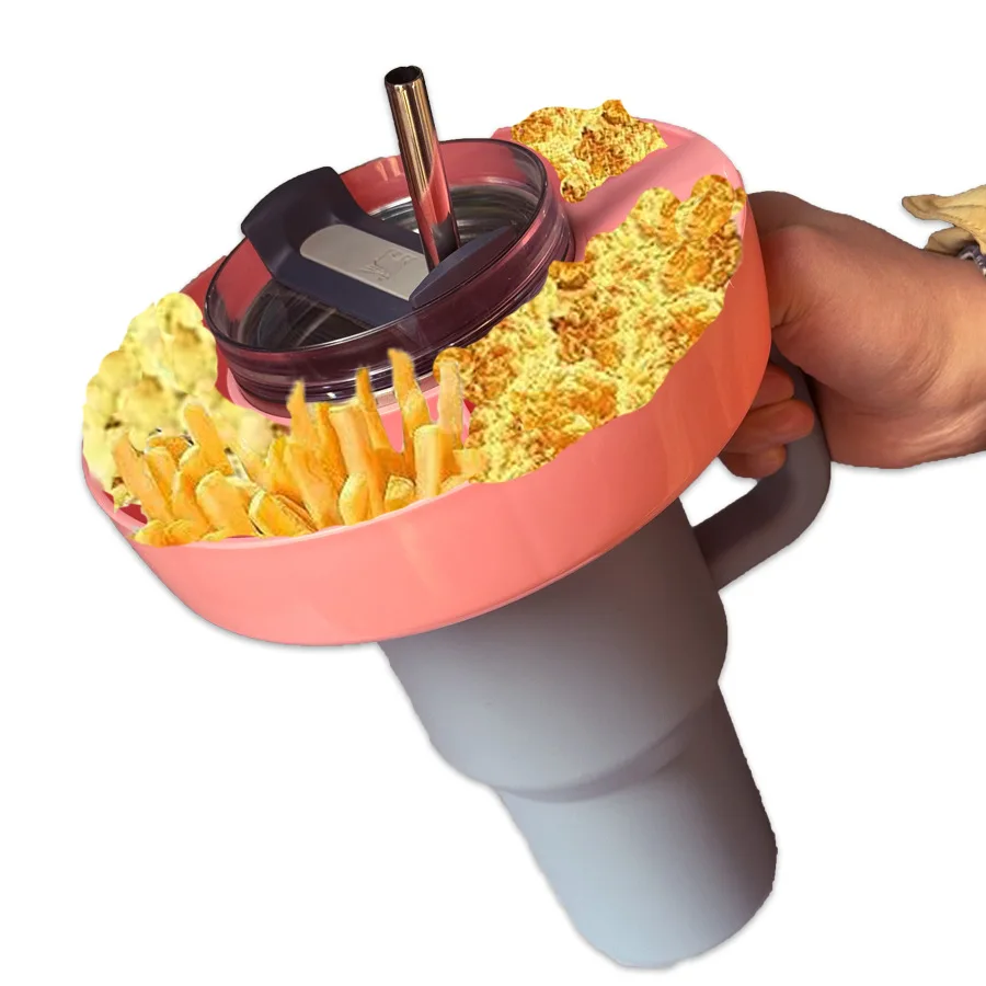 A  40 - ounce silicone tumbler - style snack bowl with a handle for the  , and a reusable snack ring