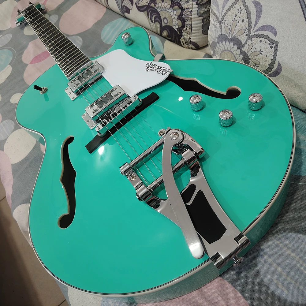 High quality mint green electric guitar, dual f-holes, large vibrato system, in stock and fast shipping