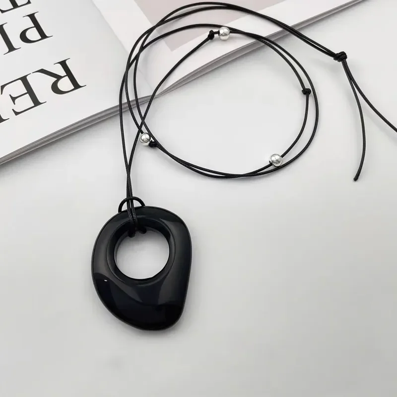 Obsidian leather rope necklace women's niche simple design autumn and winter sweater chain versatile high-end long pendant