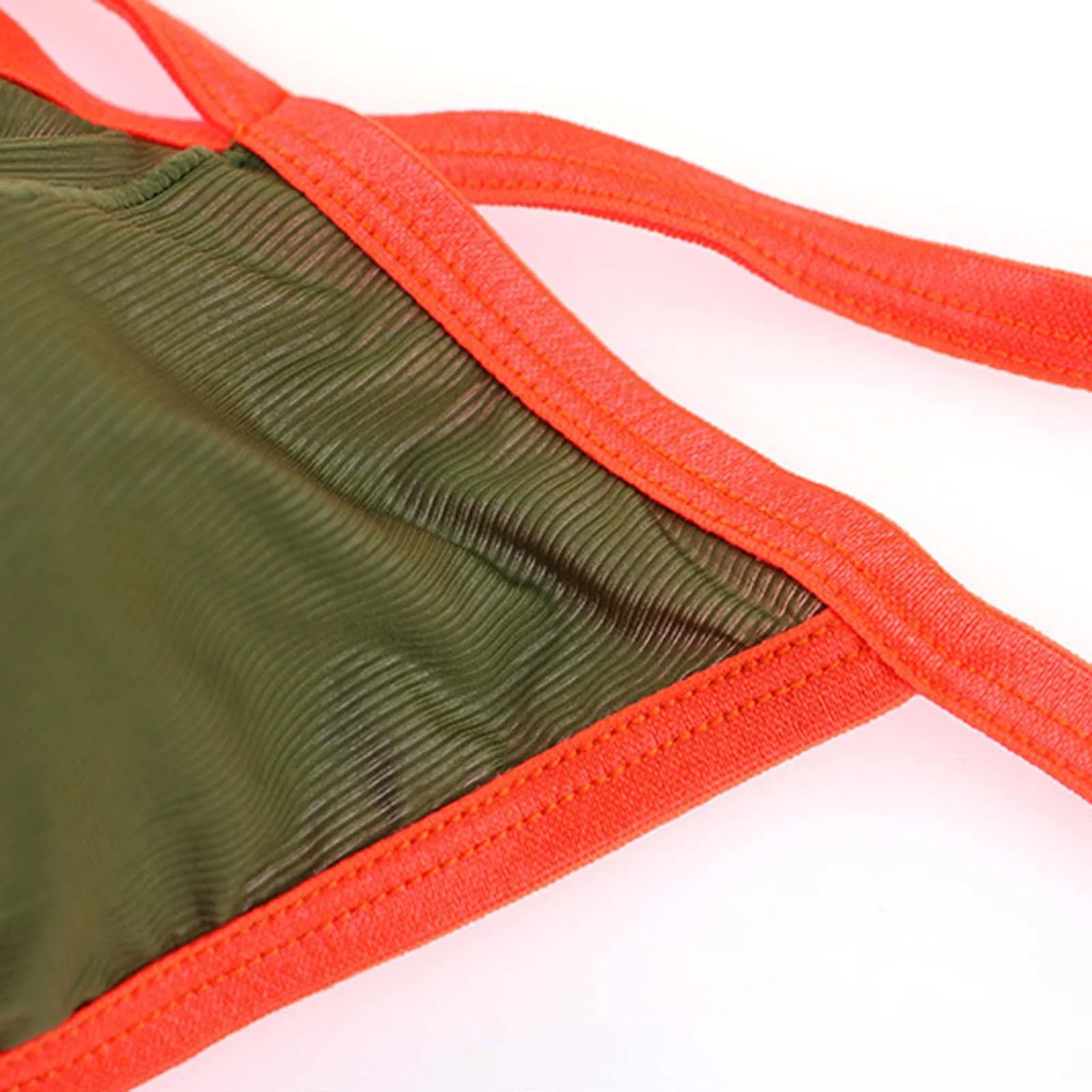 จีสตริงเซ็กซี่สำหรับผู้ชายแฟชั่นระบายอากาศได้ดีสีตัดกันสายรัดเปิดหลังรูปตัวยูเอวต่ำจีสตริง