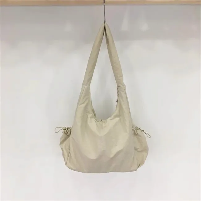 2024 Zomer Nieuwe Holle Mesh Nylon Canvas Tas Casual Trendy Merk Één Schouder Onderarm Draagtas Luxe Designer Handtassen