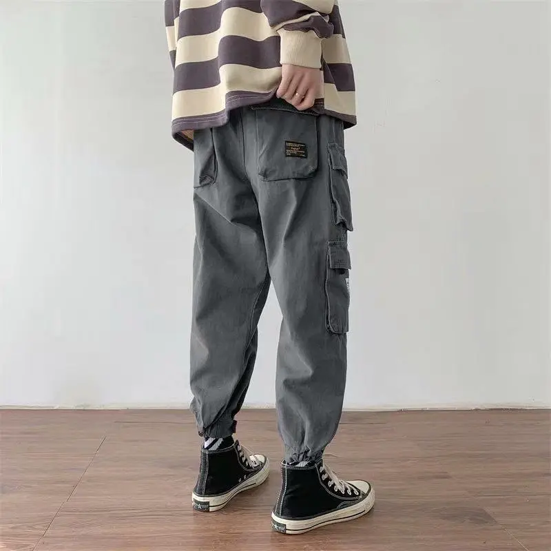 Frühling lose übergroße Herren bekleidung Trend koreanische Version lässige Mode gespleißt Tasche elastische Taille Kordel zug Cargo hose