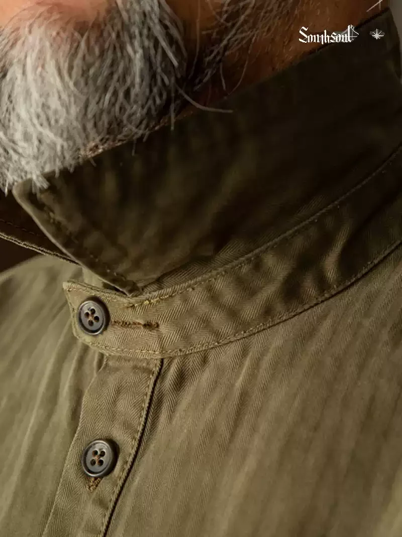 Giacca da camicia pullover con colletto Henry in puro cotone retrò americano a successo, vecchio orlo rotondo asimmetrico lavato a spina di pesce