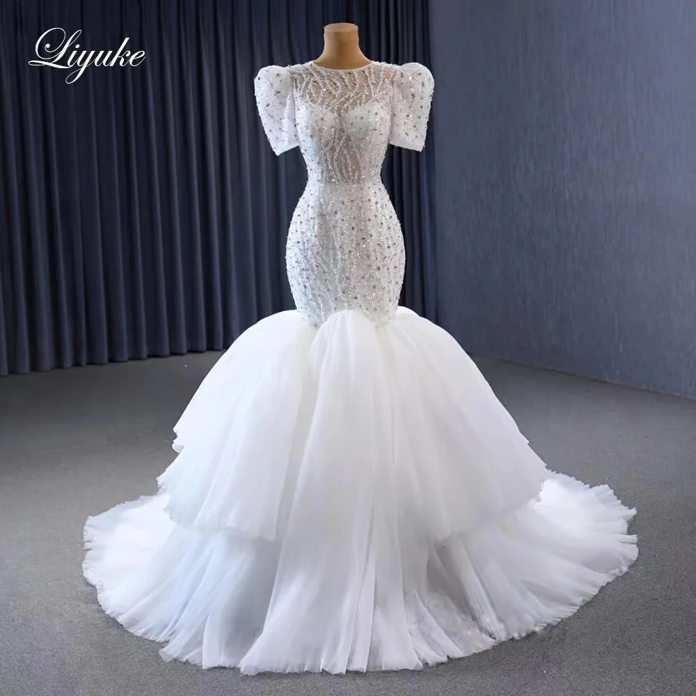 

Liyuke Luxury Lace O-Neck Mermaid Wedding Dresses Stunning Asymmetrical Beading Crystals Peals Appliques Trumpet Bridal Gowns