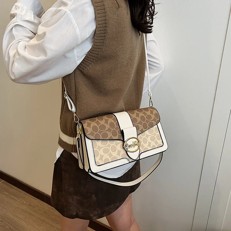 

Women's Leather Shoulder Bag Elegant And Spacious With Double Handles And Metal Accents Sophisticated Work Bag