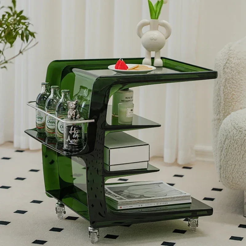 Small coffee table with movable acrylic pulley beside sofa.