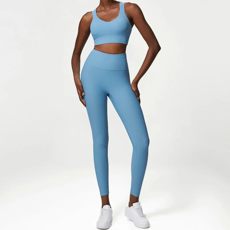 Dwuczęściowy zestaw do jogi damski jednokolorowy prążkowany materiał komplet treningowy duży wpływ biustonosz Fitness legginsy kobieta oddychająca
