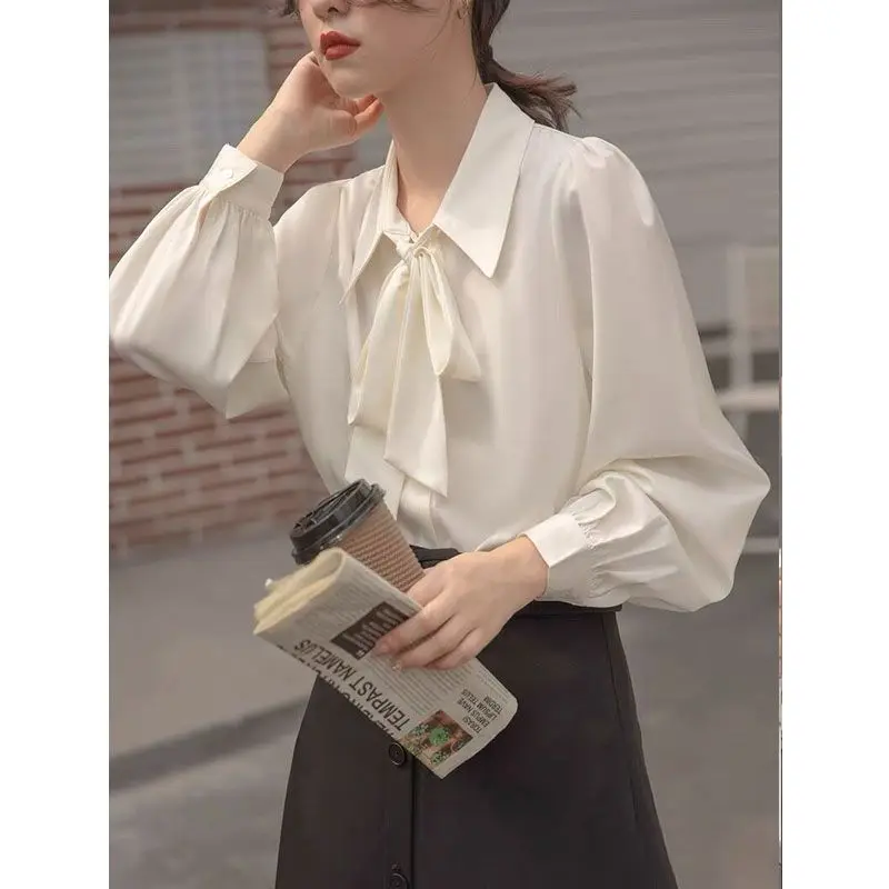 Fashion Lapel Button Spliced Loose Lace Up Bow Shirt Women\'s Clothing 2023 Spring New Casual Tops Solid Color Office Lady Blouse