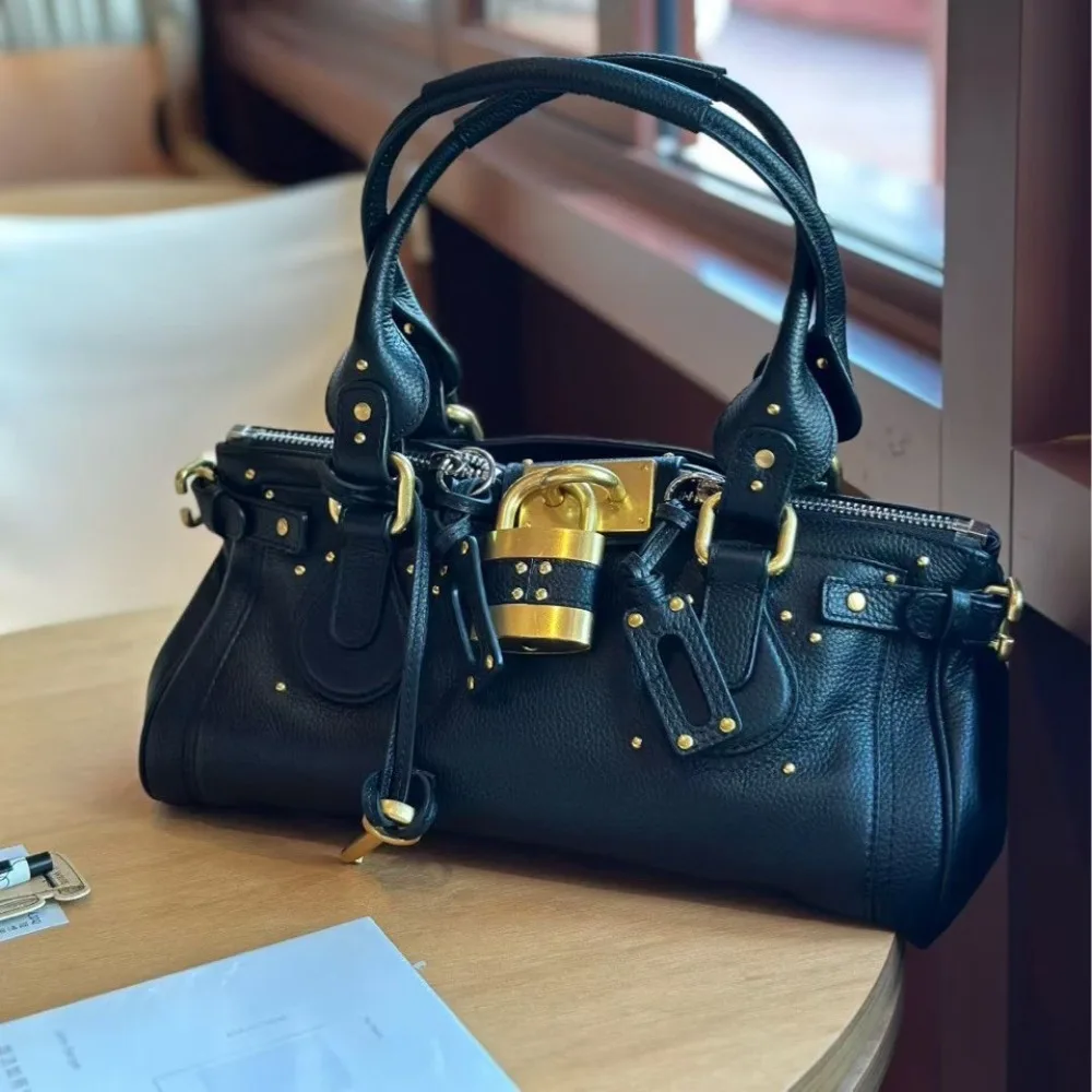 Nicho de cuero de primera calidad, estilo Medieval clásico, nicho Retro, moda versátil, bolso con cerradura antigua, bolso de hombro portátil para axila, tendencia genial