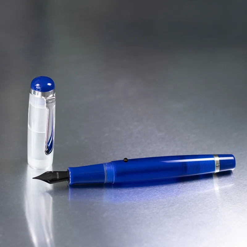 OPUS 88 OMAR Transparent Sapphire Blue Resin Fountain Pen Large Drop-feed Ink Absorption, High Ink Capacity, PVD JOWO Black Nib