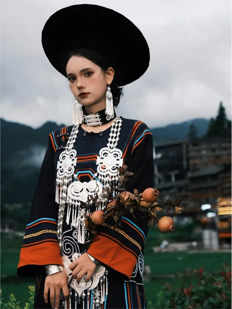 New photography of traditional women's striped cotton and linen costumes for the Torch Festival performance