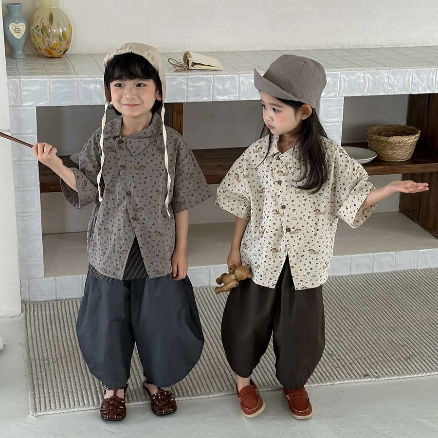 Shirt 2026 Spring and Summer New Childrens Clothing Boys and Girls Irregular Inclined Door Flap Cartoon Leopard Print Shirt
