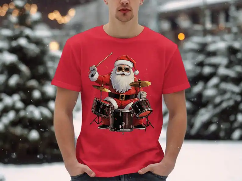 

Funny Santa Claus Drummer Christmas Gift T-Shirt, Cool Drum Playing Santa Tee for Music Lovers, Unique Holiday Band Shirt