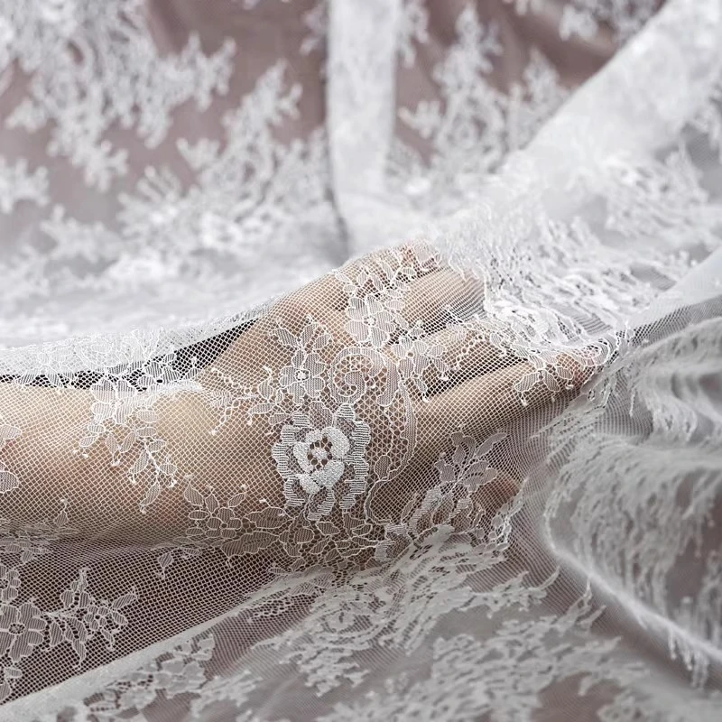 

Soft, thin and comfortable black and white French wide edge lace, suitable for wedding dresses, tablecloths and curtain fabrics.
