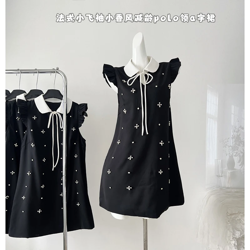 Estate nuovo nero di lusso lucido diamante vestito da partito donne moda dolce impiombato colore bianco risvolto Puff manica corta vestito da principessa