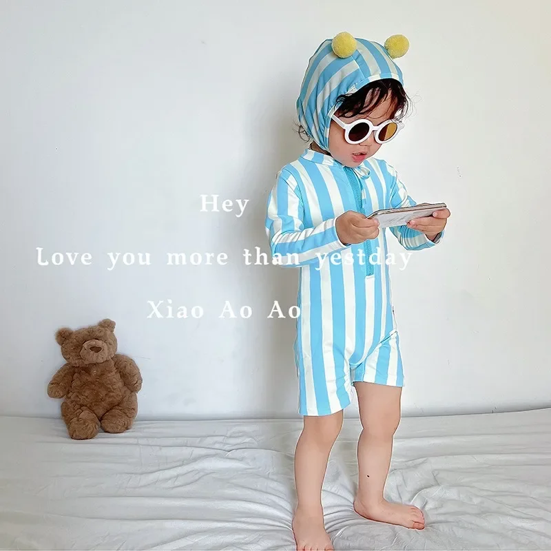 Baby girl swimwear   costume boys and girls summer 2024 new one-piece cute baby long-sleeved swimsuit sunscreen quick dry