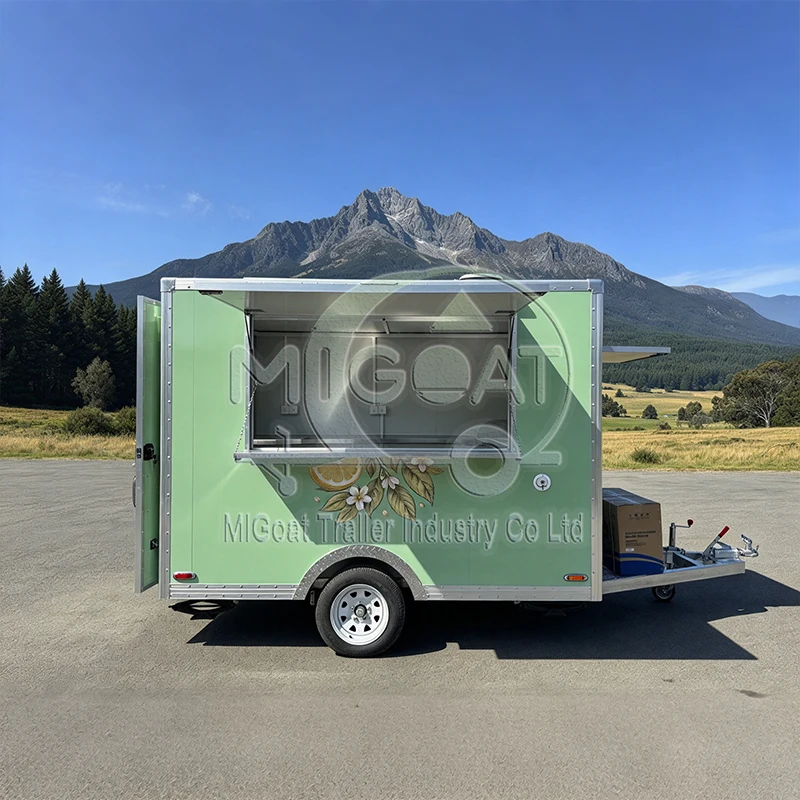 Light Green Single Axle Food Trailer with Custom Lemon Artwork and Stainless Steel Counter for Outdoor Drinks Catering