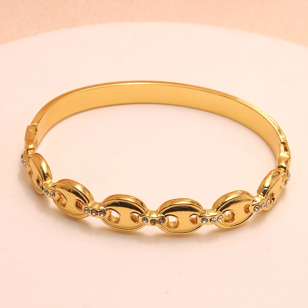 Elegant Gold Plated Stainless Steel Bangle with Openwork Zircon Pig Nose Design High-Quality Women's Fashion Bracelet