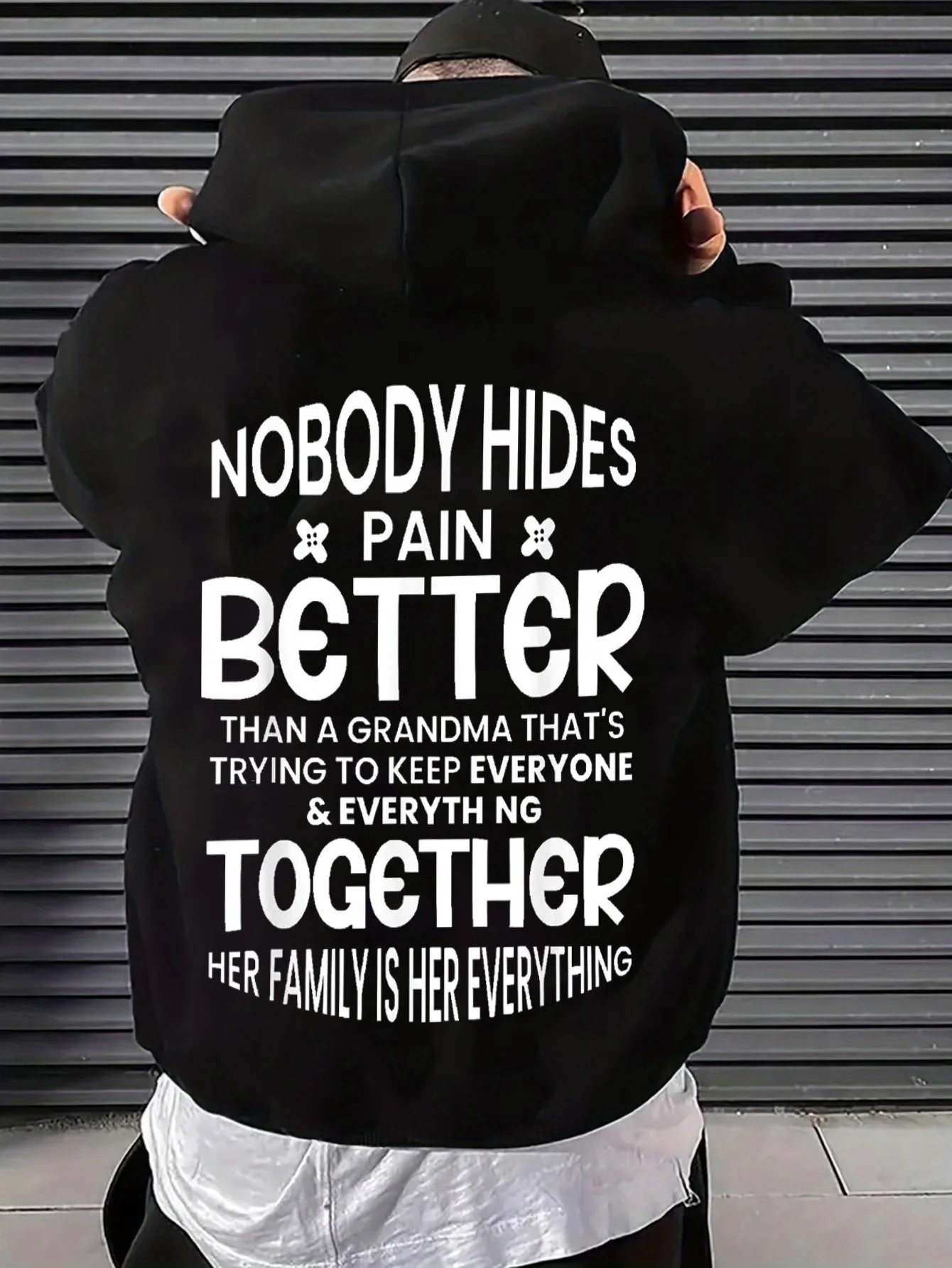 Men's Loose-Fitting Black Crewneck Sweatshirt with Inspirational Quotes about Grandmother and Family Love, Emphasizing That No One Hides Their Pain More Effectively Than Anyone Else