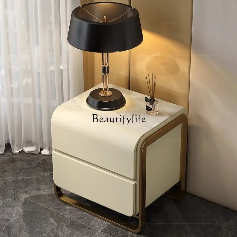 

Light luxury bedside table leather slate marble Italian modern bedroom bedside table