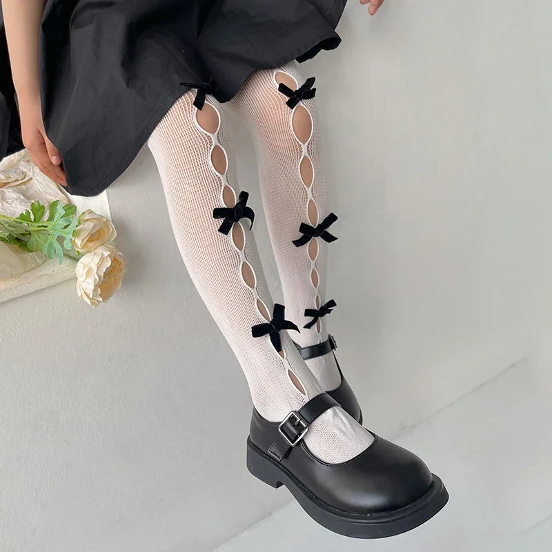 2023เกาหลีน่ารักใหม่ Bow Hollow ลูกไม้ถุงน่องฤดูร้อนบาง Fishnet สีขาวสีดำ Pantyhose Tights สำหรับเด็ก Leggings