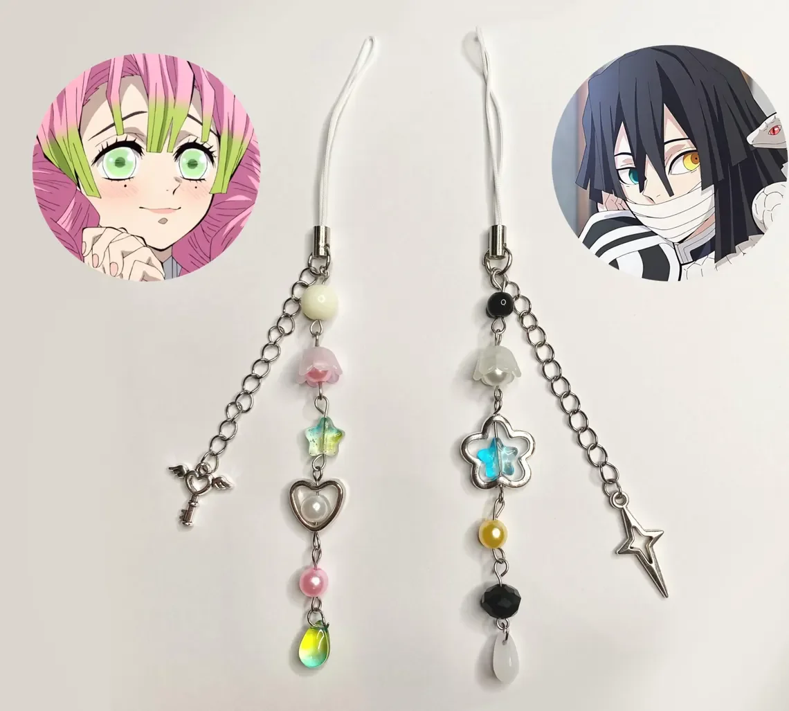 

Handmade demon anime Obamitsu Mitsuri and Obanai Phonecharm paired with phone chains, keychains, and y2k anime's stylish aesthet