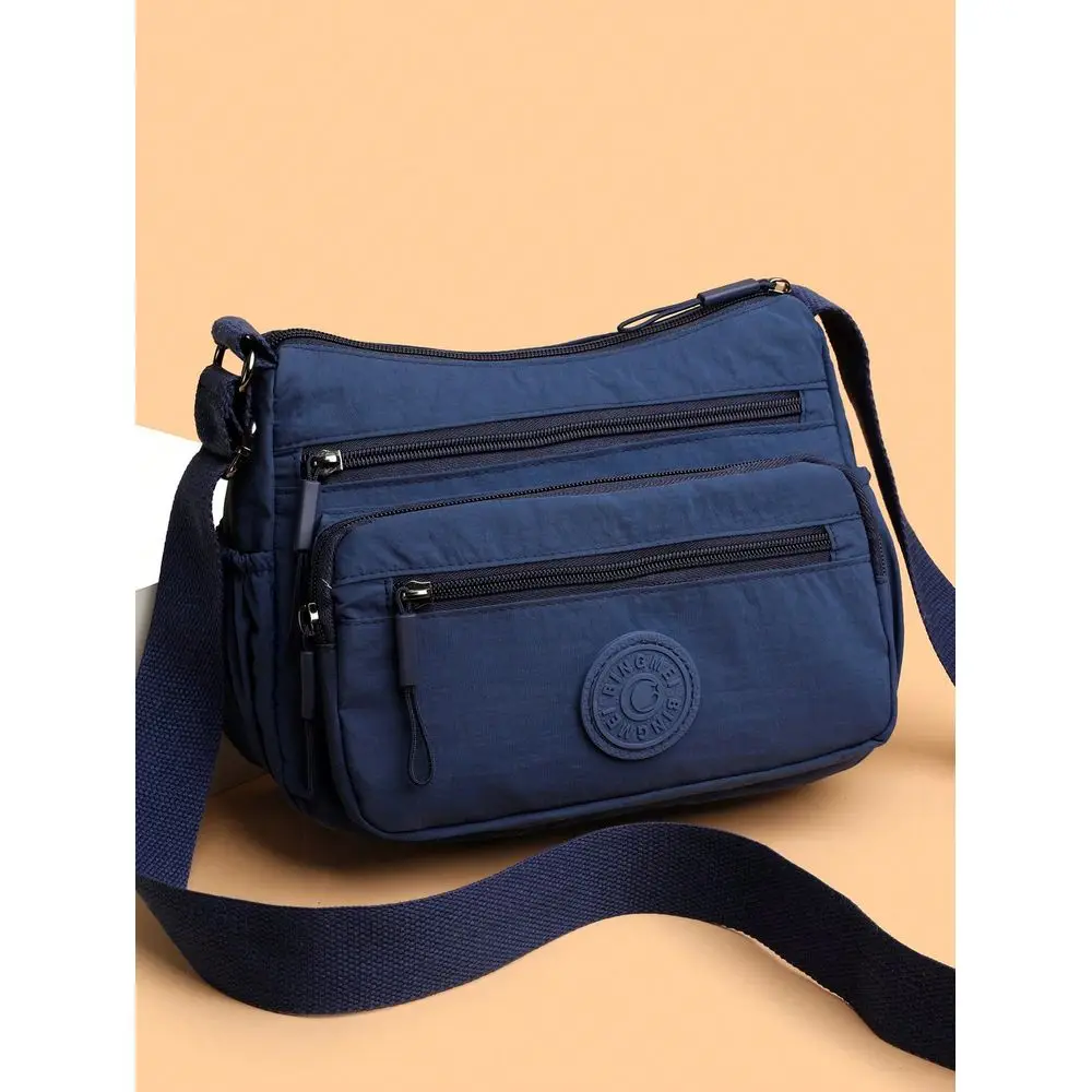 

Nylon Shoulder Bag With Adjustable Strap, MultiCompartment, Solid Color, Zipper Closure, Polyester Lining, Lightweight And Conv