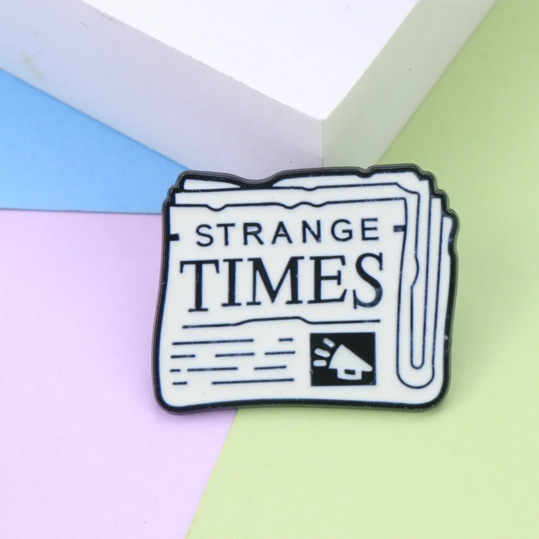 Retro Newspaper Strange Times Enamel Lapel Pin Vintage Text Metal Badge Backpack Clothes Decor Brooch Minimal Aesthetic Gift