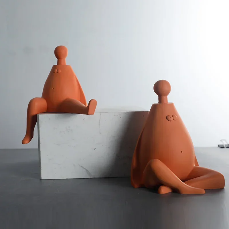 Modern simple orange person ornaments Hotel model room Home living room Desktop resin craft decorations