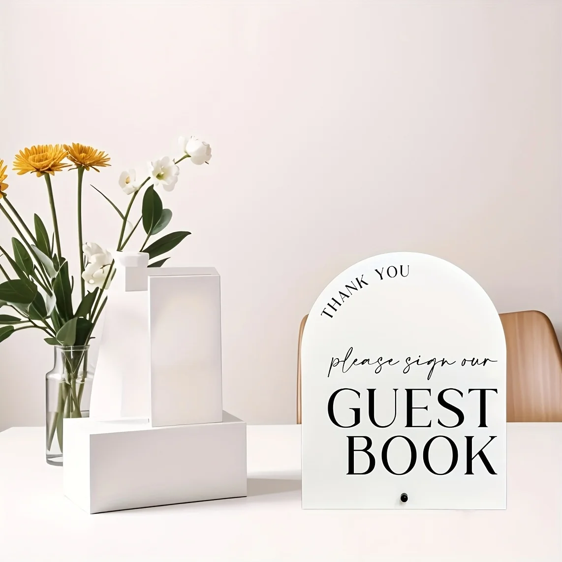 Elegant white arched guestbook sign with black stand - Polymer wedding and event table decor.