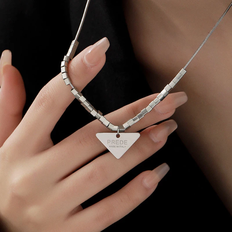 

2023 Street Personality Trend Lettering Triangle Titanium Steel Pendant Cold Wind Unisex Fashion Retro Necklace Snake Bone Chain