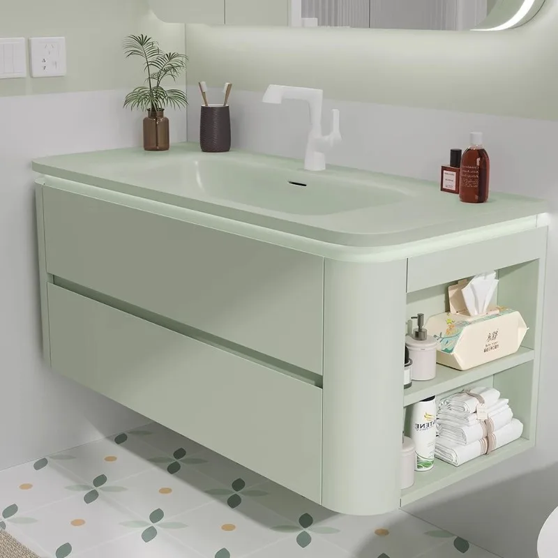 Avocado green dopamine bathroom cabinet, rounded corners, integrated ceramic basin, washstand, toilet, sink.