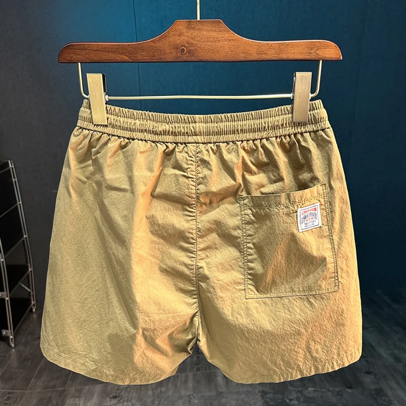 

2025 Summer New Sports and Leisure Shorts Men's Loose 34 Cent Pants Versatile Outdoor Beach Pants