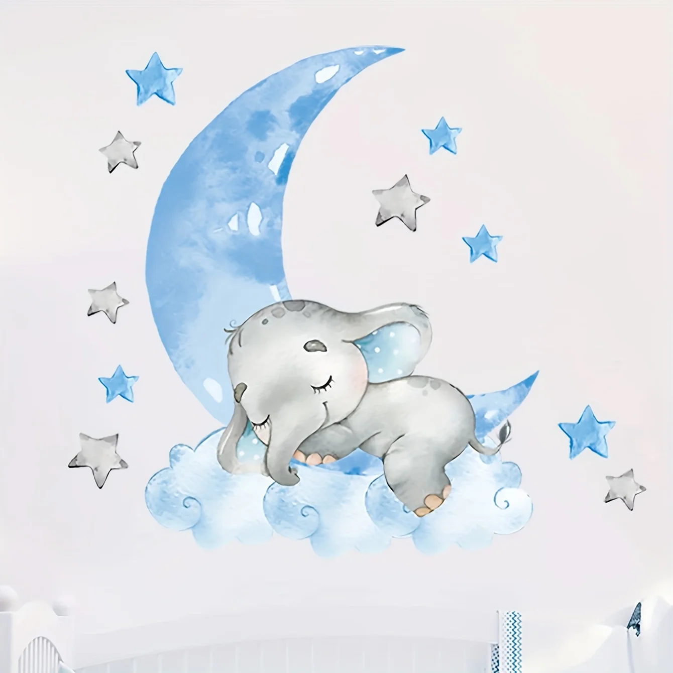 A cute 2D elephant sticker featuring blue clouds and stars adds a touch of warmth to the bedroom and playroom.