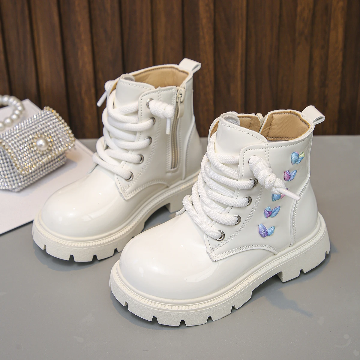 A Pair of Fashionable and Versatile Short Boots for Girls with Colorful Heart Rope Decoration and White Thick Soles