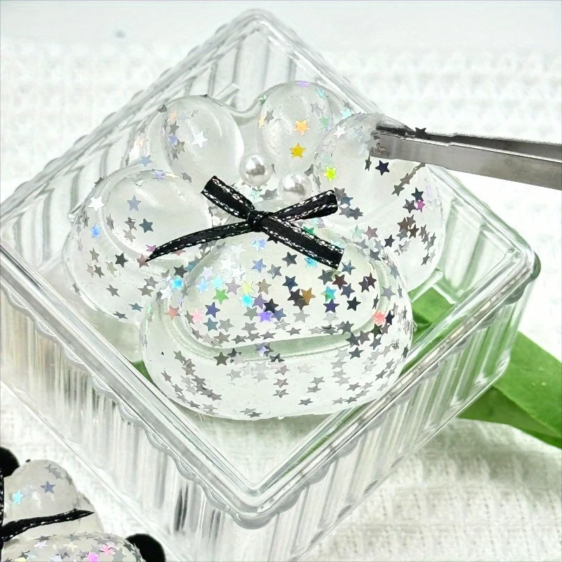 透明な弓型猫の足絞りおもちゃ