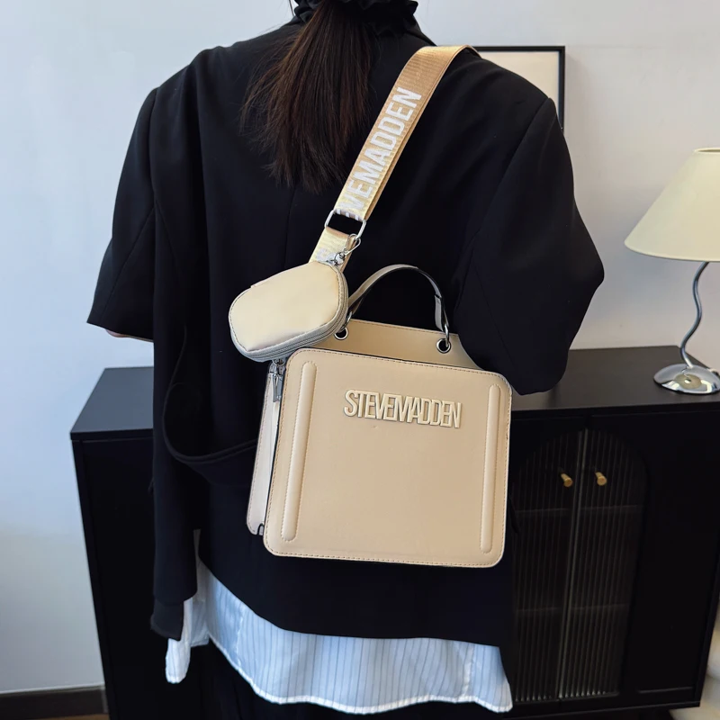

Architectural Square Crossbody with Floating Panels and Silent Closure for Urban Commutes Exuding Minimalist Poise
