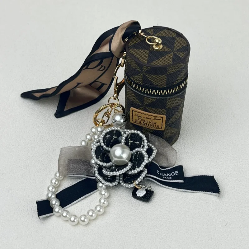 Original new small bag pendant camellia bow bag pendant keychain fashion pearl chain European and American presbyopic coin purse