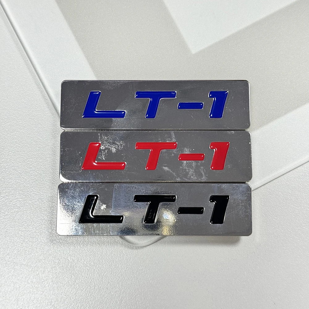 

LT-1 МЕТАЛЛИЧЕСКИЙ ЗНАЧОК ДВИГАТЕЛЯ ГНЕЗНОГО МОТОРА ХРОМИРОВАННЫЙ МЕТАЛЛИЧЕСКИЙ ЗНАЧОК с двусторонней лентой ДЛЯ КОРПУСА БАГАЖНИКА ДВЕРИ 76 мм X 20 мм